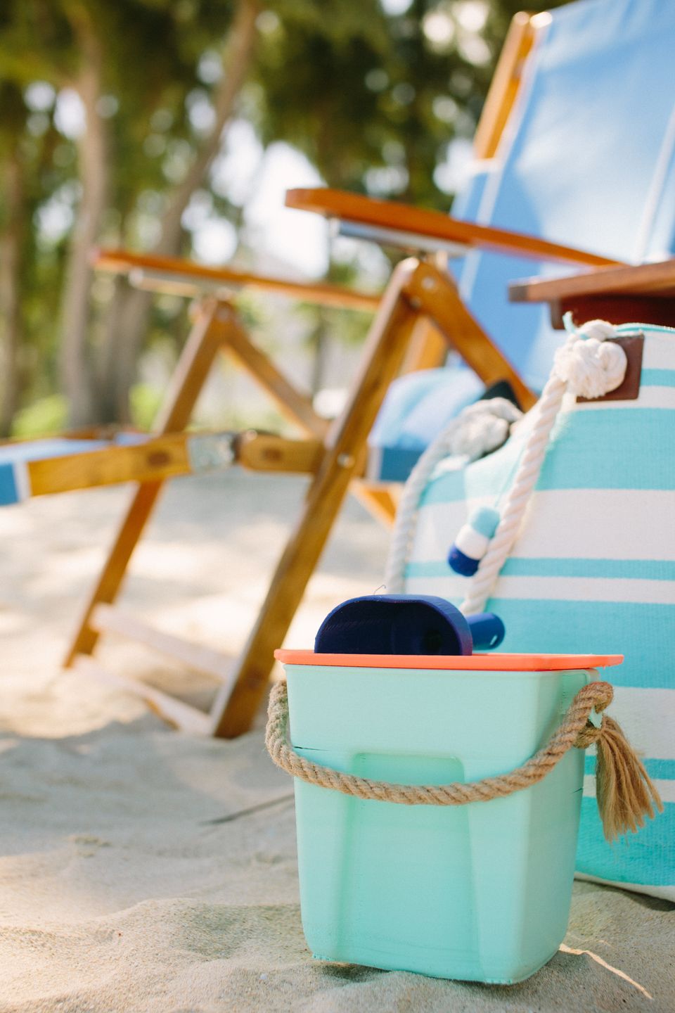 Beach Day chairs and turquoise beach-service gear arranged on the sand